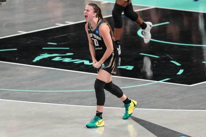 New York Liberty guard Sabrina Ionescu celebrates after a play.